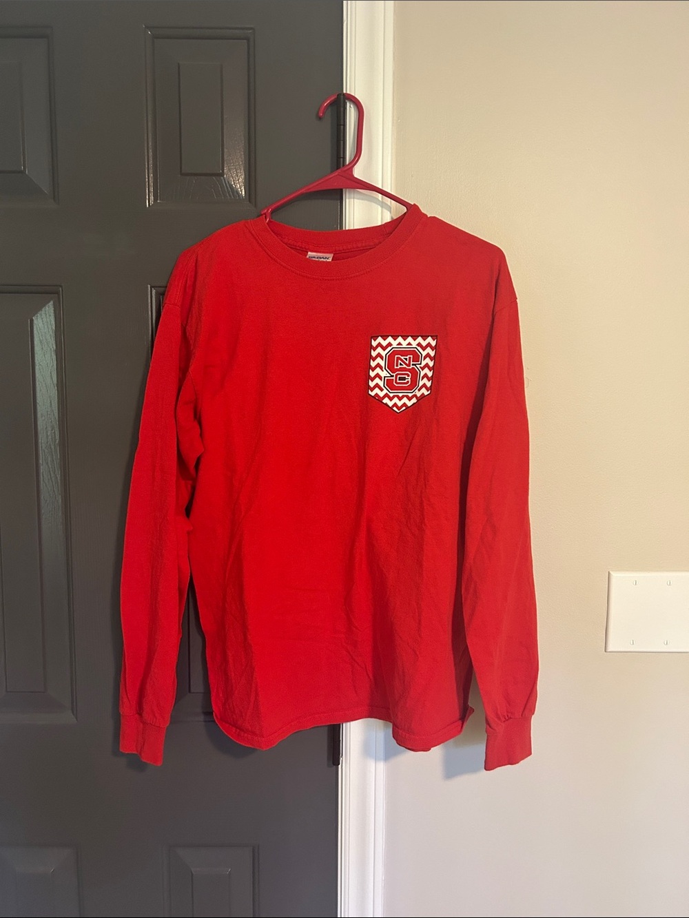 Red Long Sleeve Pocket Tee with Chevron Pocket Logo NC STATE